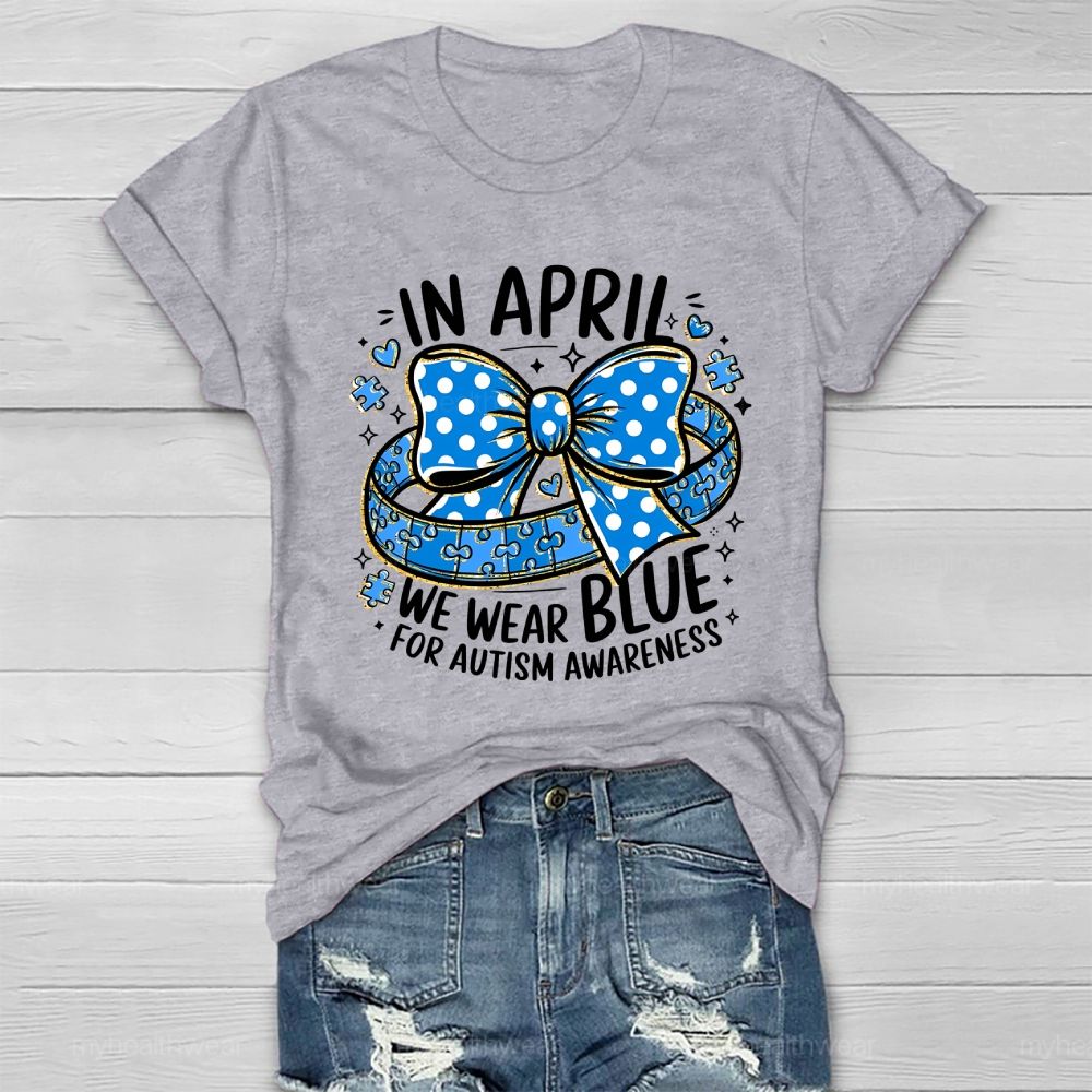 In April We Wear Blue For Autism Awareness Puzzle Pieces Polka Dots Bows Healthwear T-shirt