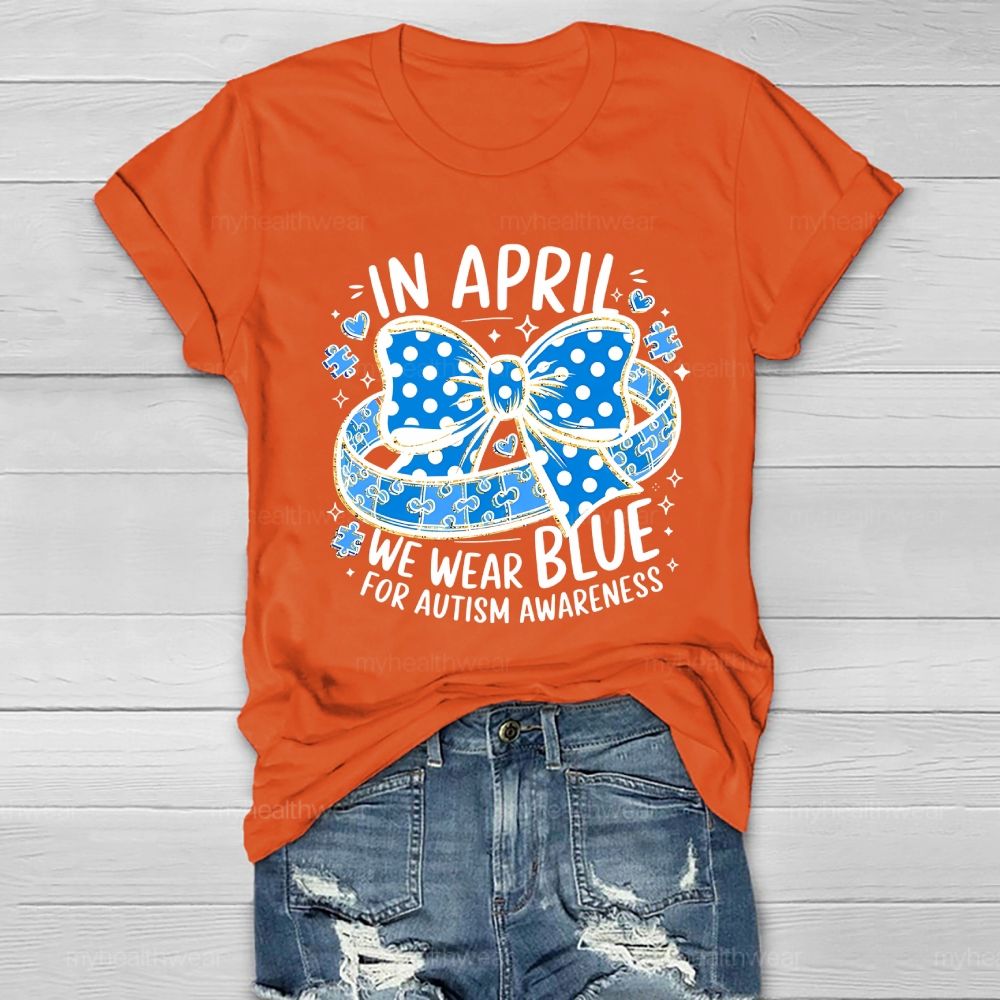 In April We Wear Blue For Autism Awareness Puzzle Pieces Polka Dots Bows Healthwear T-shirt