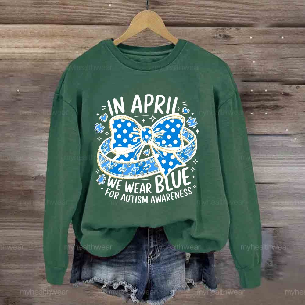 In April We Wear Blue For Autism Awareness Puzzle Pieces Polka Dots Bows Sweatshirt