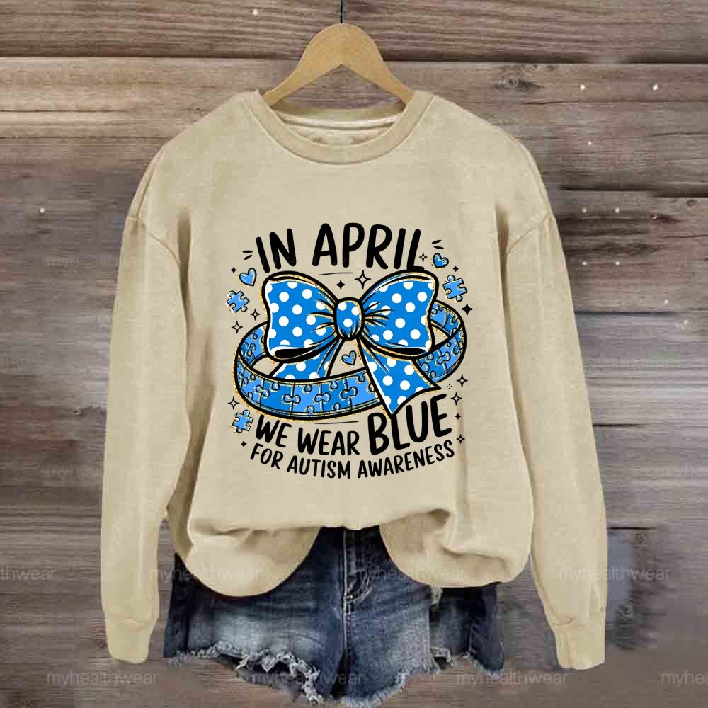 In April We Wear Blue For Autism Awareness Puzzle Pieces Polka Dots Bows Sweatshirt