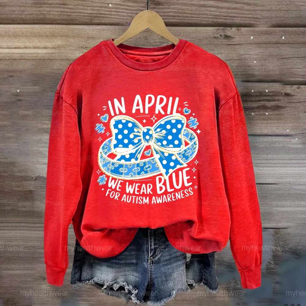 In April We Wear Blue For Autism Awareness Puzzle Pieces Polka Dots Bows Sweatshirt