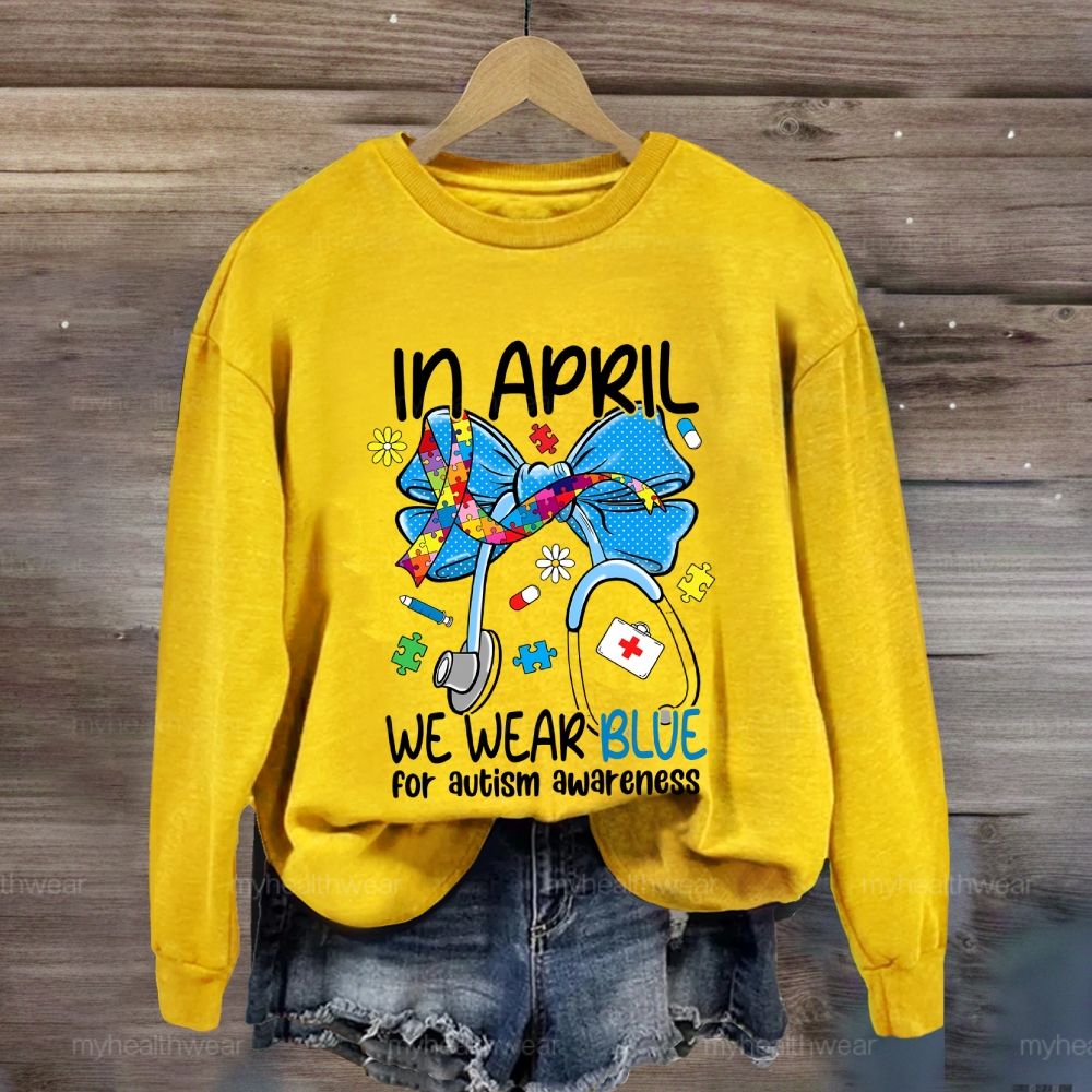 In April We Wear Blue For Autism Awareness Stethoscope Colorful Puzzle Ribbon Sweatshirt