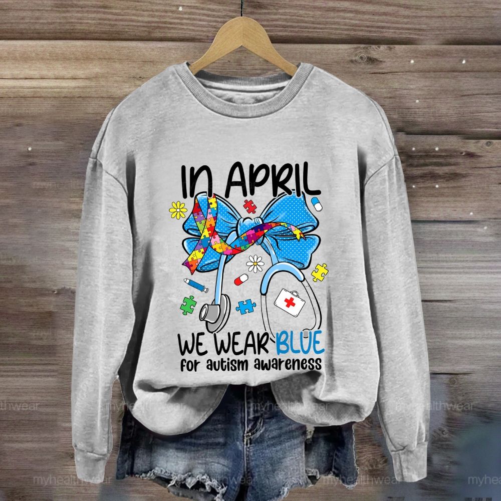 In April We Wear Blue For Autism Awareness Stethoscope Colorful Puzzle Ribbon Sweatshirt