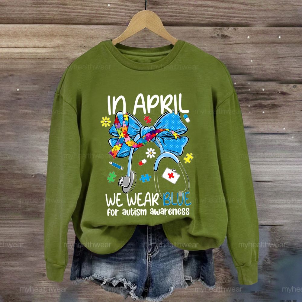In April We Wear Blue For Autism Awareness Stethoscope Colorful Puzzle Ribbon Sweatshirt