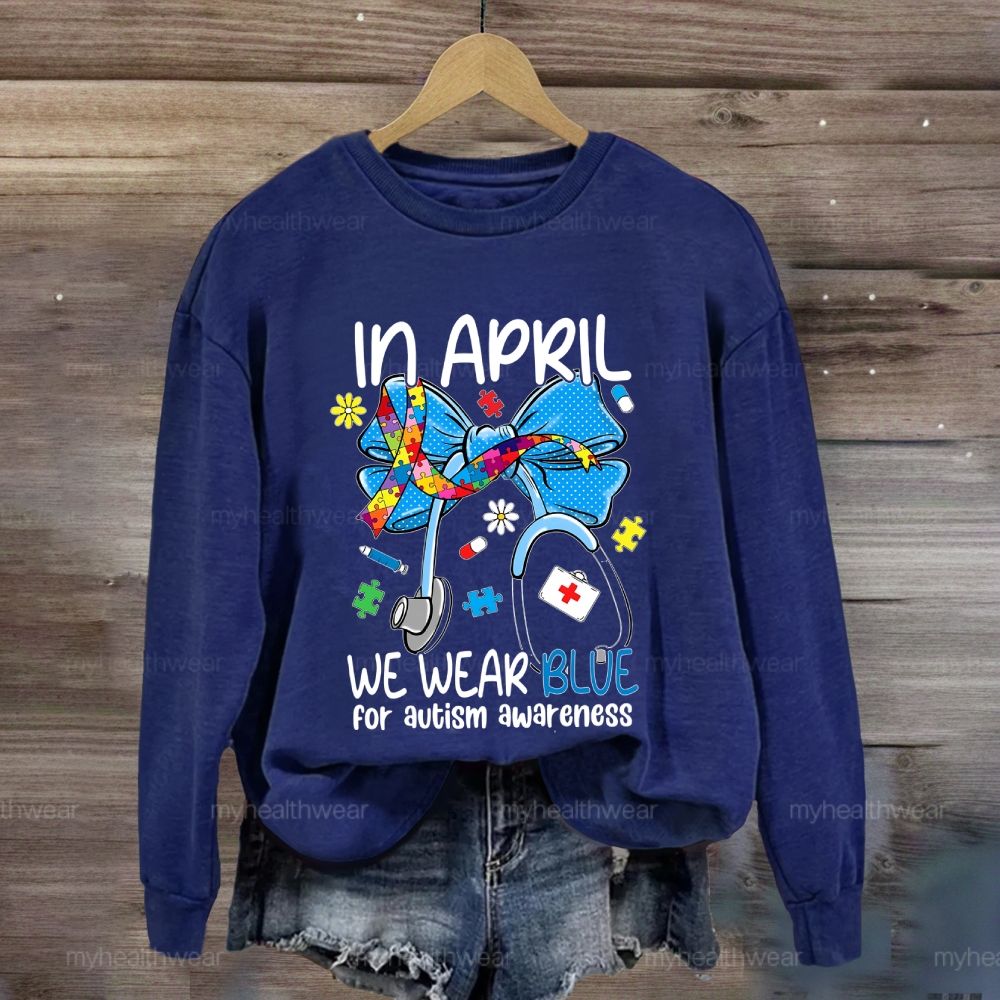 In April We Wear Blue For Autism Awareness Stethoscope Colorful Puzzle Ribbon Sweatshirt