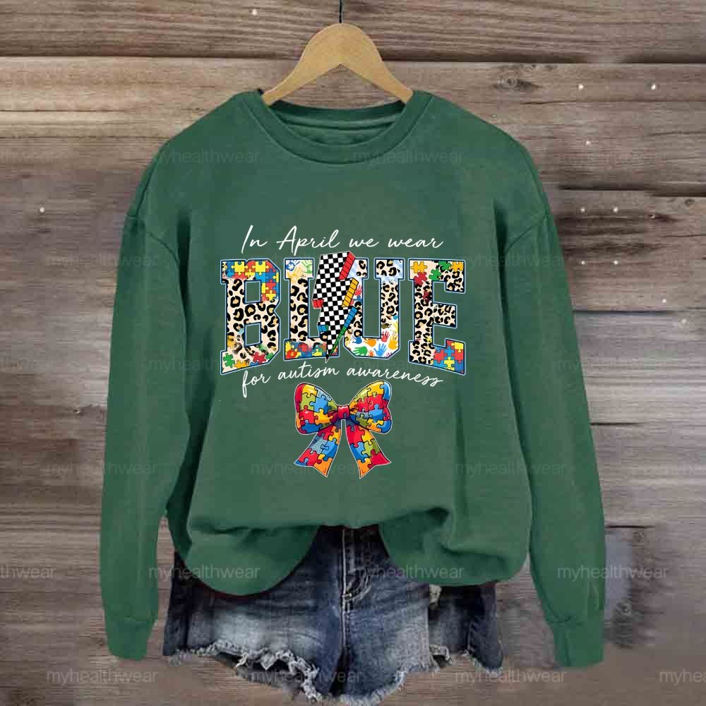 In April We Wear Blue For Autism Awareness Colorful Puzzle Bow Sweatshirt