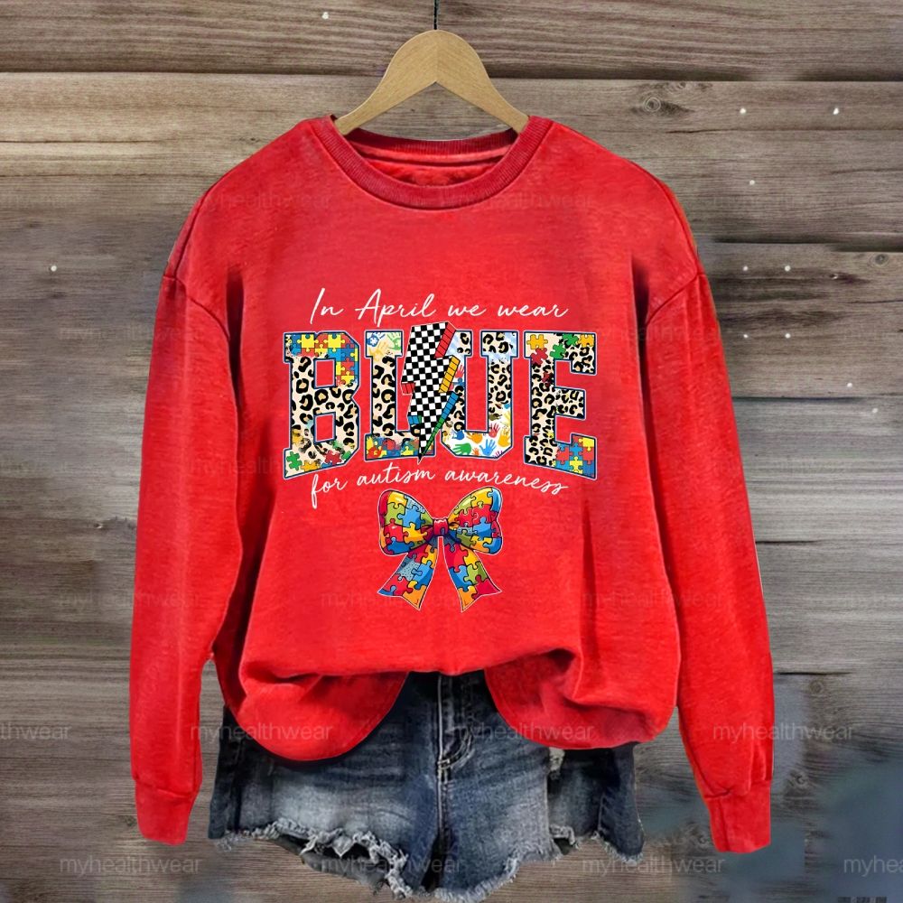 In April We Wear Blue For Autism Awareness Colorful Puzzle Bow Sweatshirt