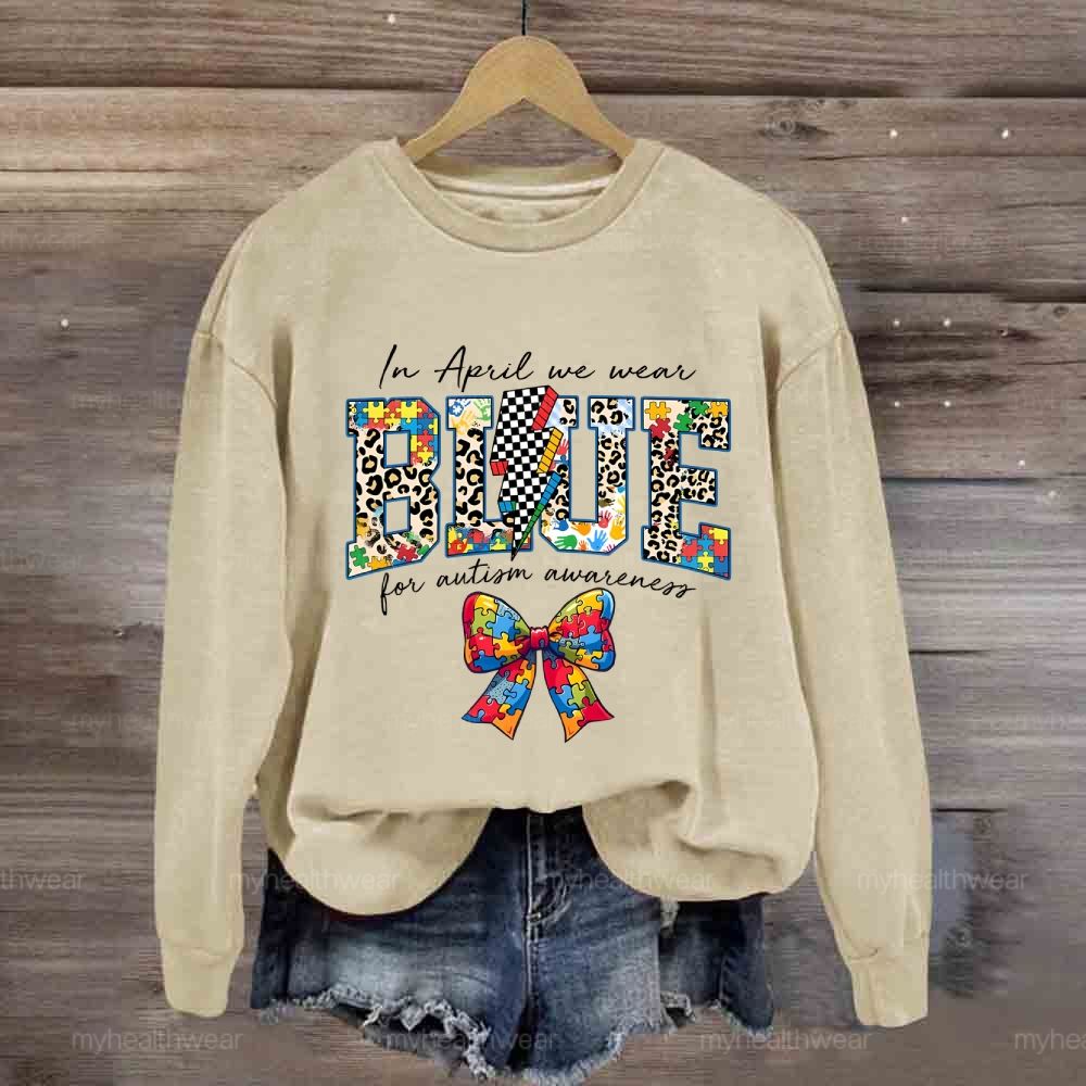 In April We Wear Blue For Autism Awareness Colorful Puzzle Bow Sweatshirt