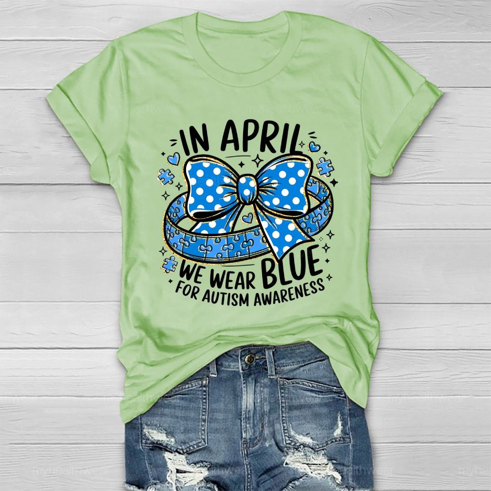 In April We Wear Blue For Autism Awareness Puzzle Pieces Polka Dots Bows Healthwear T-shirt