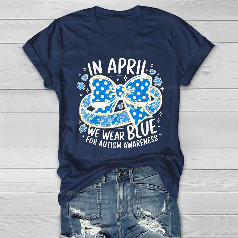 In April We Wear Blue For Autism Awareness Puzzle Pieces Polka Dots Bows Healthwear T-shirt