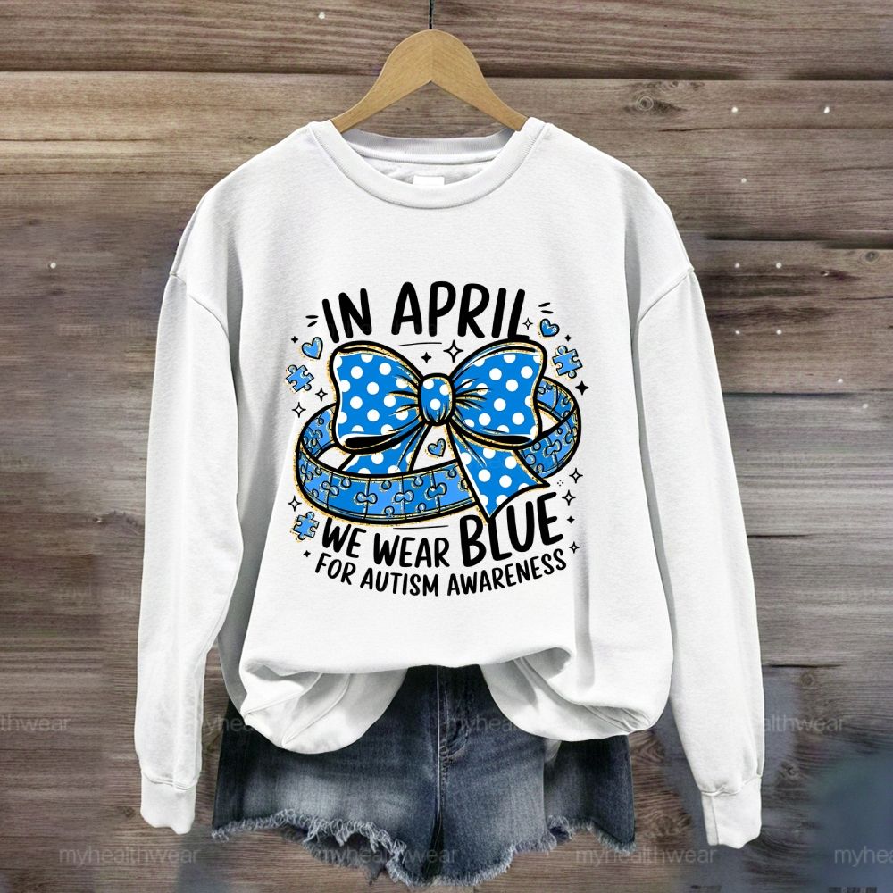 In April We Wear Blue For Autism Awareness Puzzle Pieces Polka Dots Bows Sweatshirt