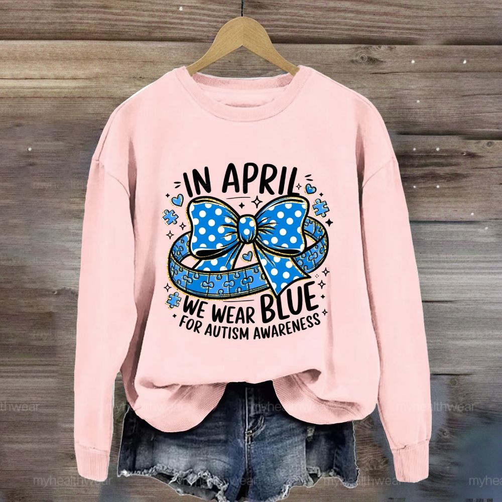 In April We Wear Blue For Autism Awareness Puzzle Pieces Polka Dots Bows Sweatshirt