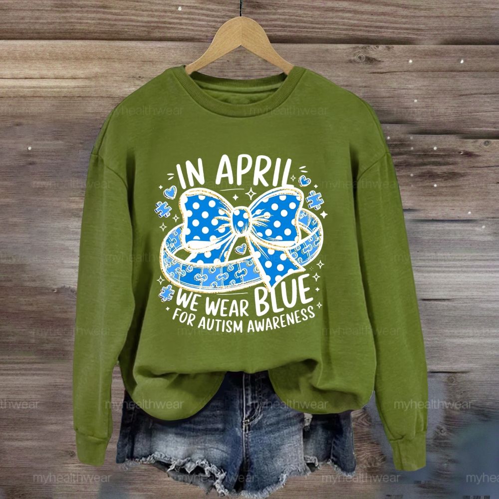 In April We Wear Blue For Autism Awareness Puzzle Pieces Polka Dots Bows Sweatshirt