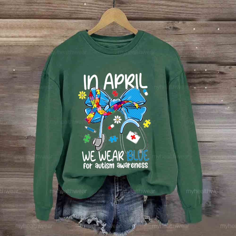 In April We Wear Blue For Autism Awareness Stethoscope Colorful Puzzle Ribbon Sweatshirt