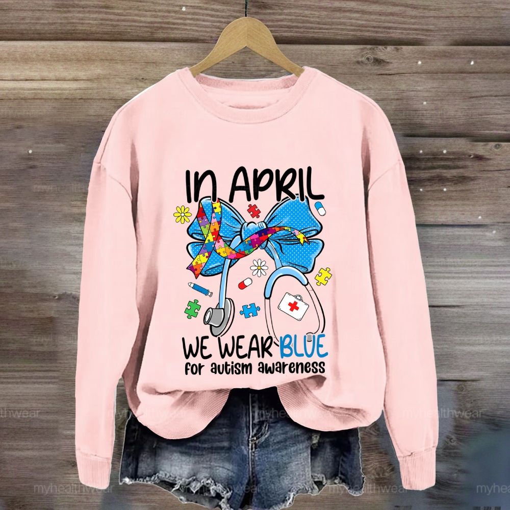 In April We Wear Blue For Autism Awareness Stethoscope Colorful Puzzle Ribbon Sweatshirt