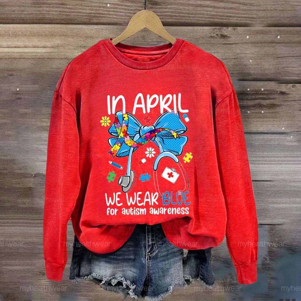 In April We Wear Blue For Autism Awareness Stethoscope Colorful Puzzle Ribbon Sweatshirt