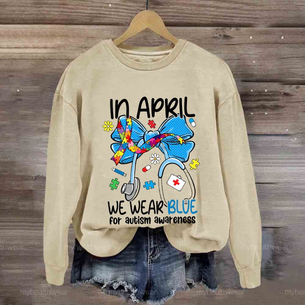 In April We Wear Blue For Autism Awareness Stethoscope Colorful Puzzle Ribbon Sweatshirt
