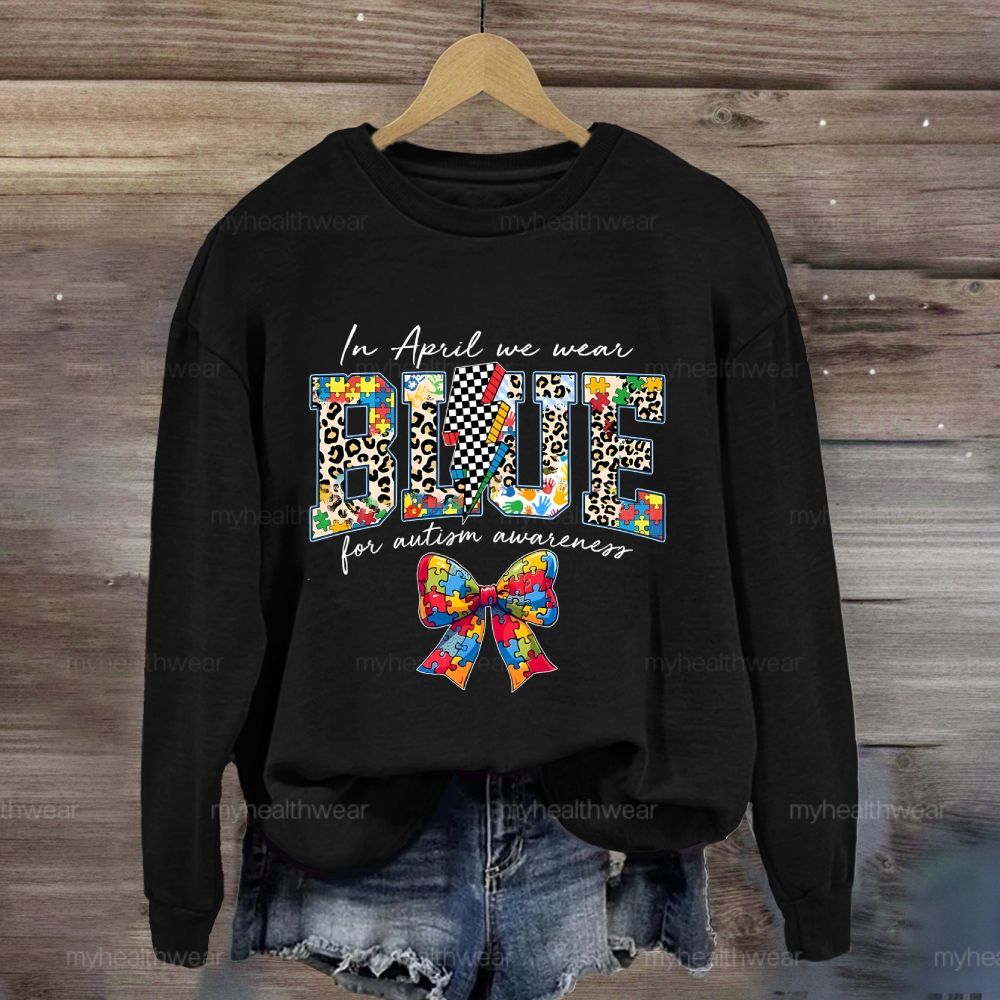 In April We Wear Blue For Autism Awareness Colorful Puzzle Bow Sweatshirt