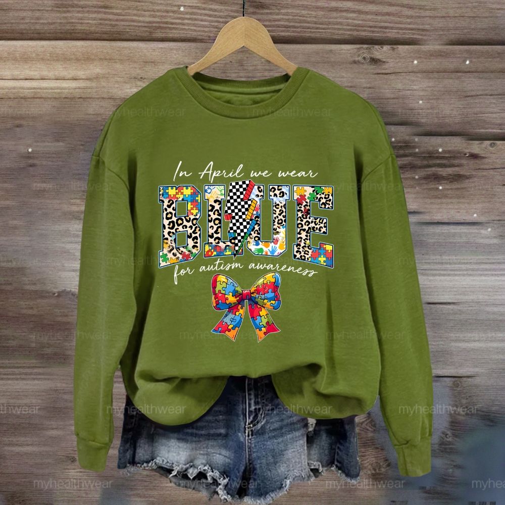 In April We Wear Blue For Autism Awareness Colorful Puzzle Bow Sweatshirt