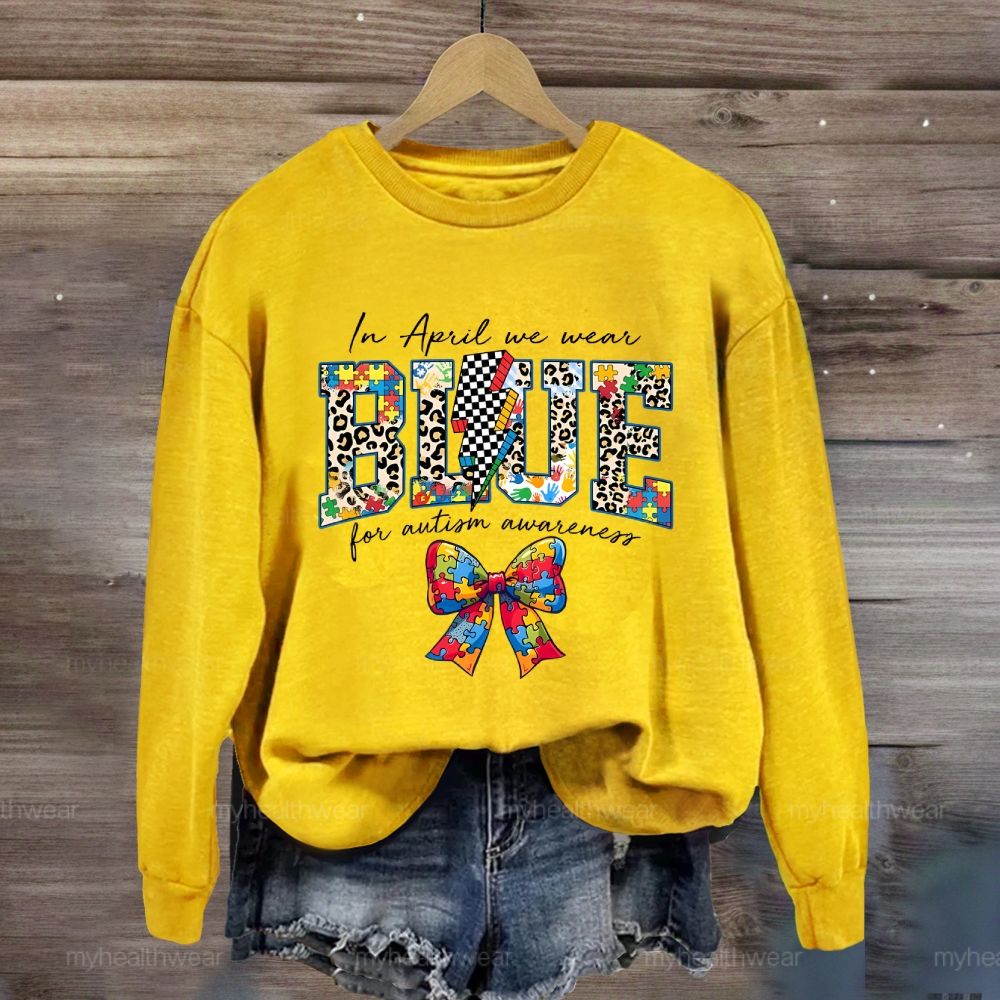 In April We Wear Blue For Autism Awareness Colorful Puzzle Bow Sweatshirt