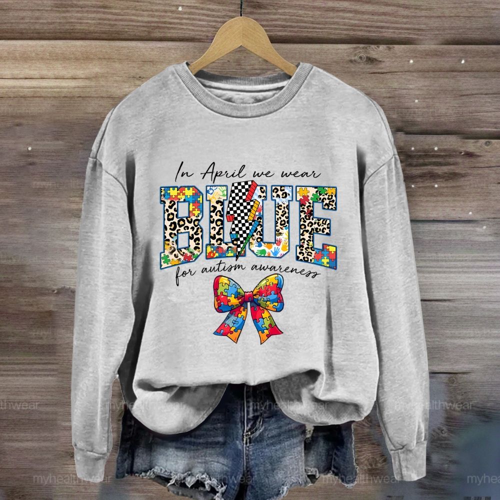 In April We Wear Blue For Autism Awareness Colorful Puzzle Bow Sweatshirt