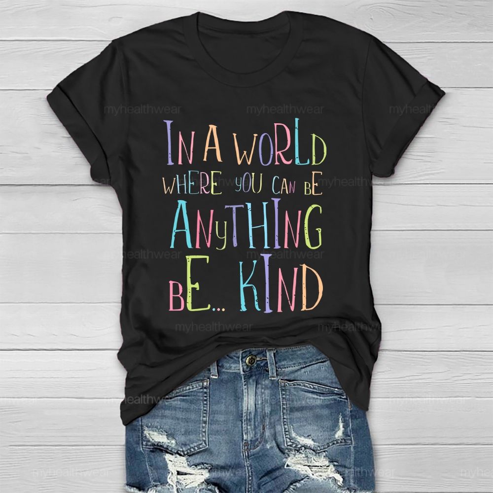 In A World Where You Can Be Anything Be... Kind Colorful Letters Graphics  Healthwear T-shirt
