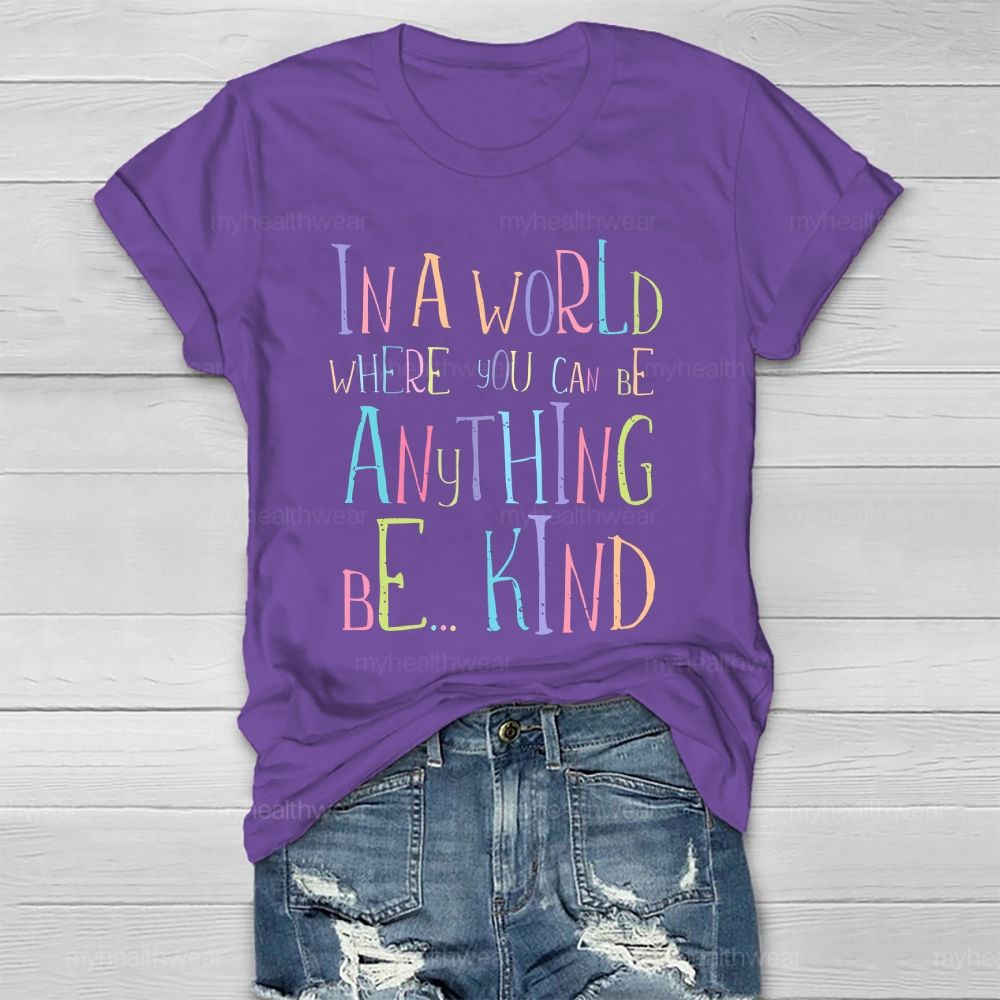 In A World Where You Can Be Anything Be... Kind Colorful Letters Graphics  Healthwear T-shirt