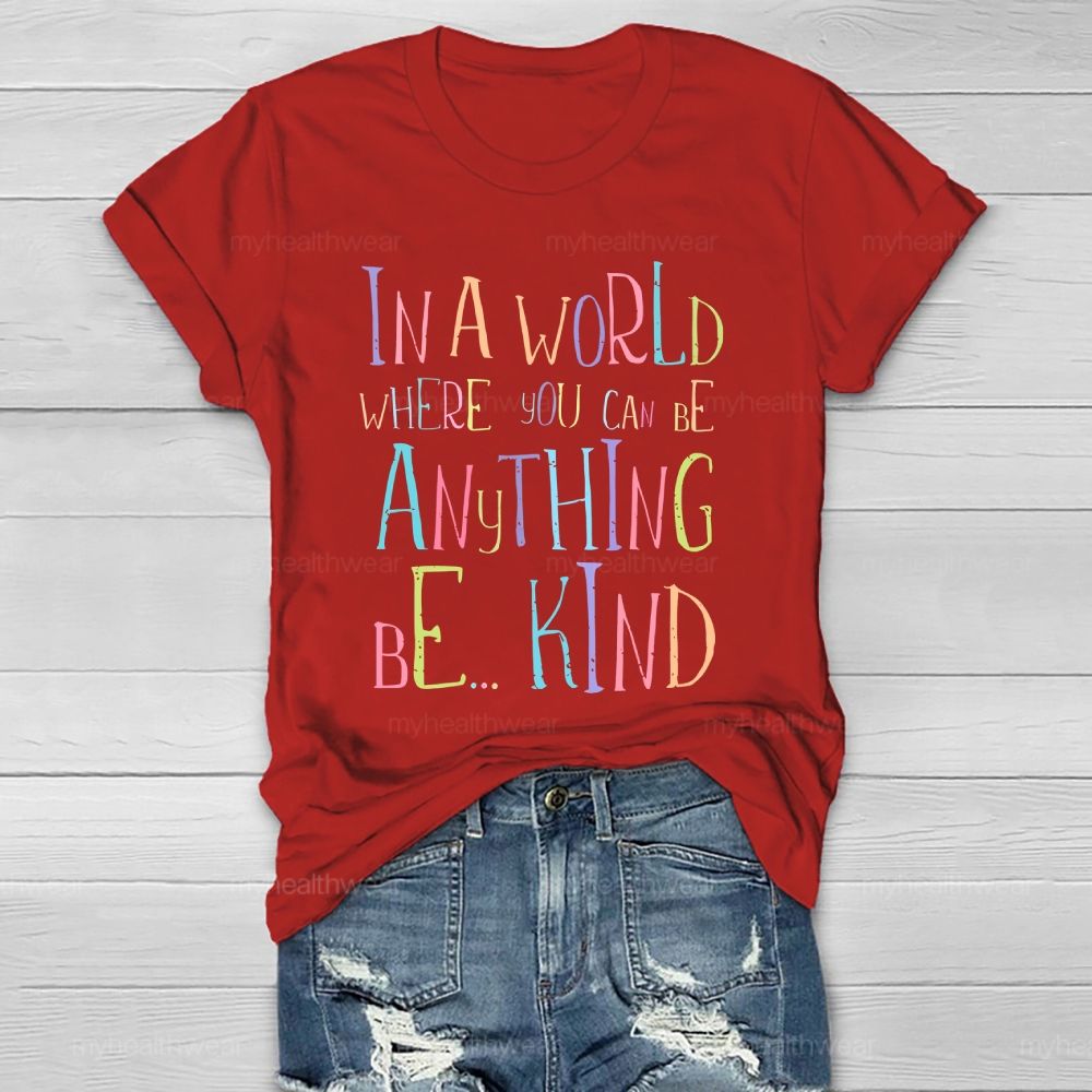 In A World Where You Can Be Anything Be... Kind Colorful Letters Graphics  Healthwear T-shirt
